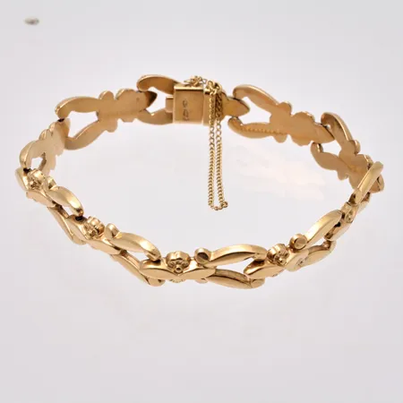 Armband i 18K guld, 18,5cm, bredd 10,7mm, vikt 12,98g.