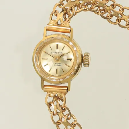 Damur Fazetta, 18K guld i länk och boett, längd 18,5cm, bredd 7,5-18mm, 18K, 18,3g