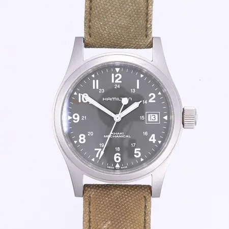Herrur Hamilton Kahki Mechanical Ø38mm, manuell, datum, matterat stål, ref H694190, serienummer 9LXPK01HQ, smärre bruksslitage buckla under ena bandhornet, slitet tygband original, medföljer ett natoband ej original samt ett mockanato ej original, inga övriga tillbehör