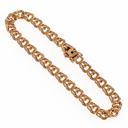 Armband Bismarck i 18K guld. Det är 19 cm långt, 6 mm brett och väger 11,8g. Kistlås. Stämplad R9 (1967), CFG (Bengt Hallberg Guldsmeds AB, Köping), 18K, kattfot. 