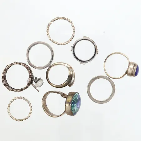 Tio ringar i olika utföranden stl 16-18, silver 925/1000 Vikt: 48,5 g