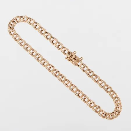 Armband Bismarck 18k,slitage,längd ca 19 cm,bredd 4.5 mm. Vikt: 6,6 g
