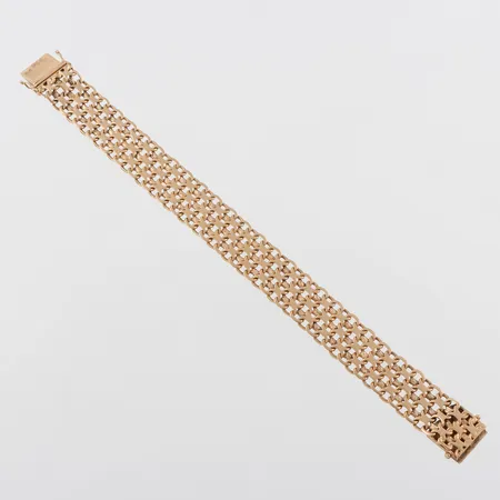 Armband 18k X-länk, längd ca 19.5 cm,bredd 15.4 mm,bruksslitage. Vikt: 36,6 g