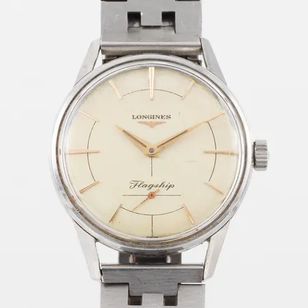 Herrur Longines Flagship,tickar igång men ej funktionstestad,diameter ca 35.5 mm,repig.