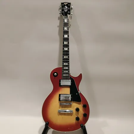 Elgitarr Hondo II, modell: HLP-2RS, single cutaway, sunburst, Made in Korea, stötskador, hårt fodral, defekt fodral Skickas med postpaket.