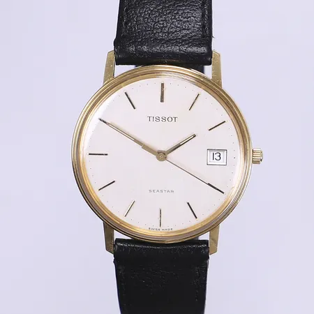 Armbandsur Tissot Seastar Ø34mm quartz datum läderband (går ej)  tjänstegravyr boett i  18K bruttovikt 29,8g  