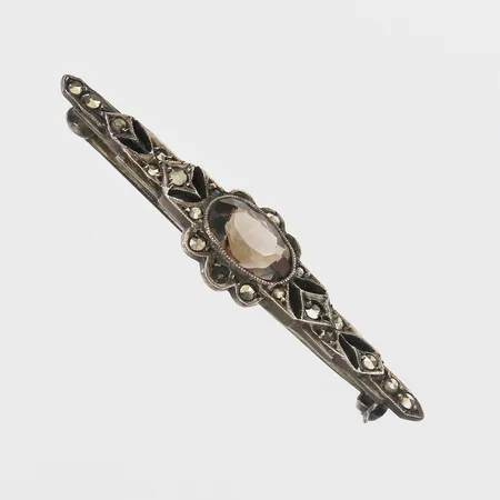 Brosch med brun sten och markasiter längd 47mm, bredd 12mm, en sten saknas, silver 935/1000 Vikt: 3,9 g