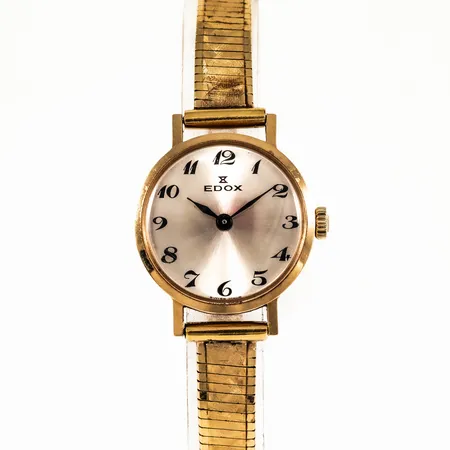 Damur EDOX guld 18K manuell 21,5mm plexiglas, doublélänk med viklås, svaga repor på glas, inga tillbehör. 