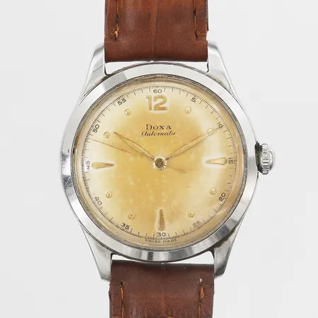 Herr klocka Doxa, automatisk, Ø36, stål, boettnummer 5261026, plexiglas, med brunt läderarmband ej original, inga tillbehör, slitage, missfärgad urtavla, repor/märken.