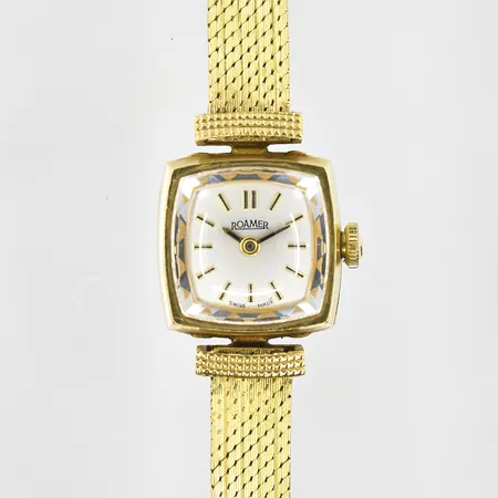 Damur Roamer 18K med integrerad länk 18K, manuell, boett 16x16mm, serienr 468 8620, fungerade vid testtillfället, inga tillbehör, bruttovikt 29,2g.