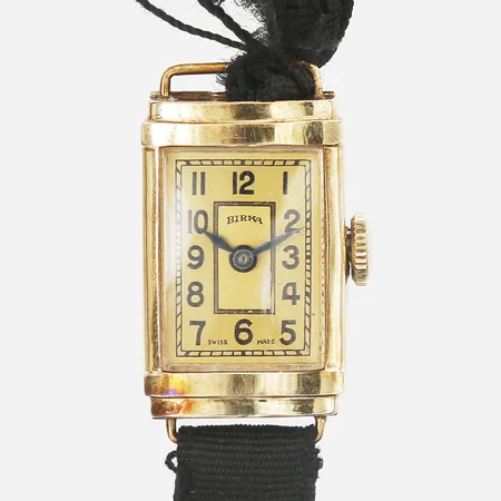 Damur Birka 14K 22x14mm, manuell, plexiglas med repa, svart tygband defekt, inga tillbehör 