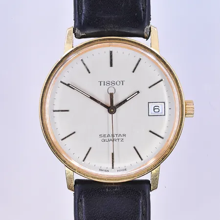 Herrur Tissot seastar quartz Ø33 mm datum, graverad 18K.