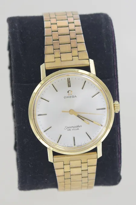 Herrur Omega Seamaster De Ville stål/guld på stål manuell 34mm, originalglas med repor, gravyr box.