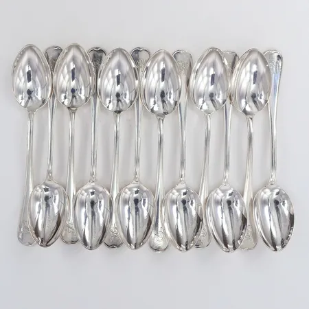 Tolv skedar längd 12cm monogram Silver 830/1000.  Vikt: 140,6 g