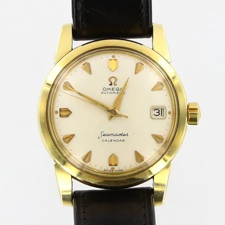 Herrur Omega Seamaster calendar, automatisk, guld på stål Ø34mm, läderband och spänne original, originaletui, repigt plastglas, något anfrätta visare