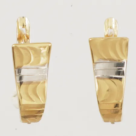 Ett par örhängen längd 16,1mm, bredd 4-7,5mm tvåfärgade 18K  Vikt: 1,8 g