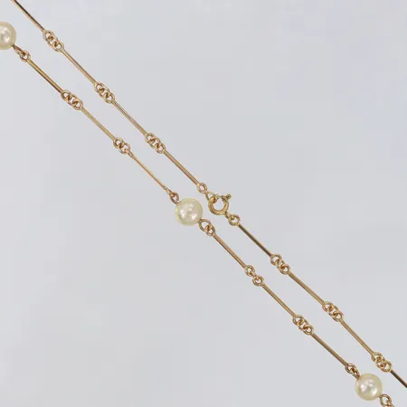 Collier med odelade saltvattenpärlor halvstelt Ø6,5mm längd 51,5cm pärlor med slitage 18K.  Vikt: 9,9 g