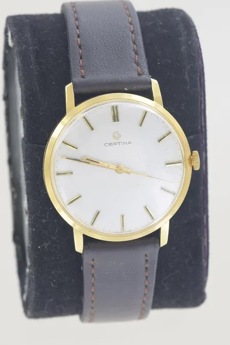 Herrur certina manuell diam 34 mm, graverad 18K