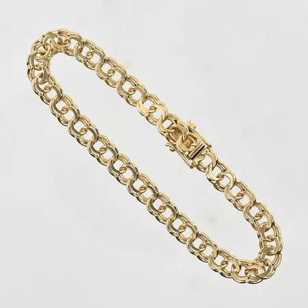 Armband Bismarck längd 19cm, bredd 6mm, glappt lås, 18K. Vikt: 14,8 g