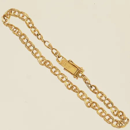 Armband Bismarck längd 16,5cm bredd 3,8mm, bindögla i metall samt ojämn länk 18K Vikt: 3,2 g