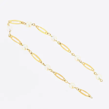 Armband odlade pärlor Ø4mm längd ca 16cm bredd 3-4mm, går ej att öppna 18K. Bruttovikt: 1,9 Vikt: 1,9 g
