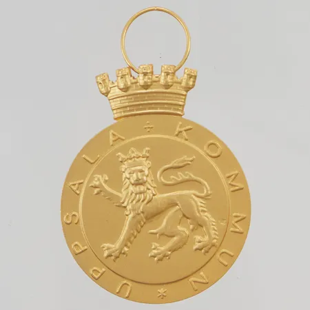 Guldmedalj graverad 18K 30,6g.