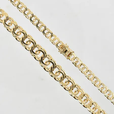 Collier Bismarck doserad GHA längd 45½cm, bredd 7-12mm, 18K. Vikt: 50,1 g