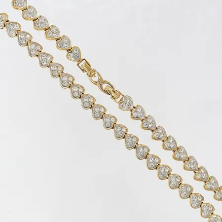 Kedja med vita stenar Nina Ricci längd 42,5cm gulmetall. 