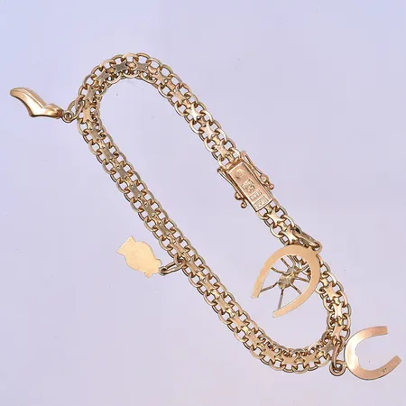 Armband X-länk med 4 berlocker längd 18,5 cm, bredd länk 6 mm 18K. Vikt: 12,6 g
