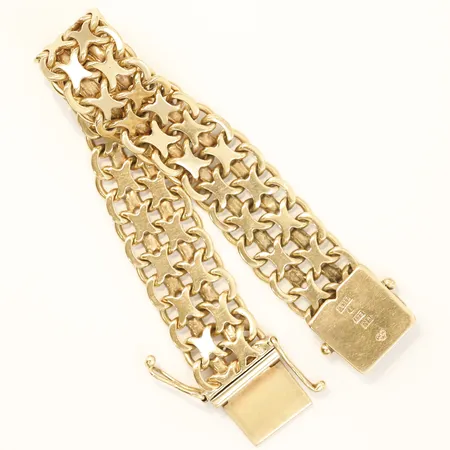 Armband X-länk längd 18cm, bredd 16,2mm	Mikkov Ab August år1963 18K Vikt: 48,6 g