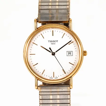 Herrur Tissot guld 18K quartz Ø34mm, datum, safirgflas, flexiband i metall, svart läderband original (oanvänt) medföljer, gravyr För nit och redlighet i rikets tjänst. 