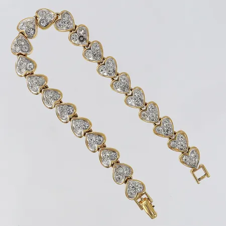 Armband med vita stenar Nina Ricci längd 18,5cm gulmetall. 