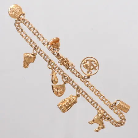Armband Bismarck längd 19 cm, bredd 3,5mm, 9st berlocker, 18K Vikt: 9,7 g