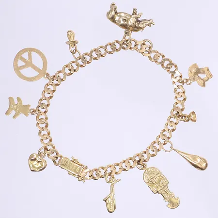 Armband Pansar svenska stämplar 1958 med totalt 10 berlocker längd 18,5 bredd 5mm, 4 berlocker med bucklor, 1 berlock (noshörning) av omkring 10K guld, 18K Vikt: 22,5 g