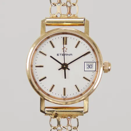 Damur Eterna Ø 22mm, 18K, quarts, datum, graverad bakboett, armband X-länk 18K, längd inklusive uret 16,5cm, bredd 9mm, länken något skev, batteribyte krävs, bruttovikt: 16,8g