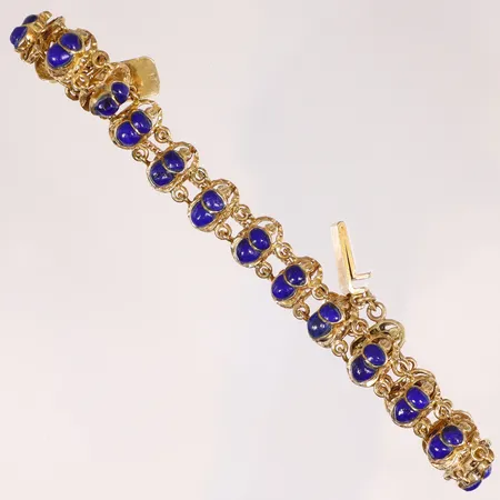 Armband med skarabéer med stenar/emalj i blått längd ca 18,5cm bredd 10mm, troligen Egypten 18K Vikt: 24 g