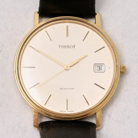 Herrur Tissot Seastar i 14K guld quartz datum, Ø33,5mm, gravyr För nit och redlighet, läderband, i behov av batteribyte, box.