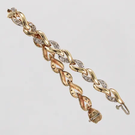 Armband med diamanter ca 38x0,01ct längd: ca 17½cm bredd: ca 6mm vit/gult guld 14K Vikt: 12,9 g