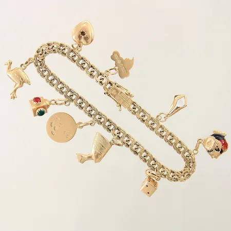 Armband Bismarck med 9 berlocker längd 19cm bredd 5,5mm, färgbortfall, en sten saknas, gravyr 18K Vikt: 20,5 g