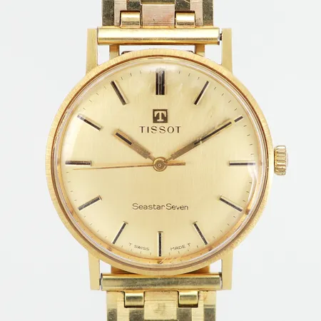 Herrur Tissot Seastar Seven automatisk Ø33mm, boett 18K, armband gulmetall, slitage på glas, skev länk, gravyr