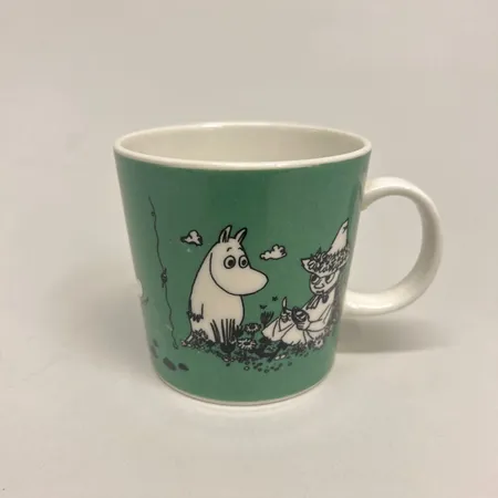 Muminmugg, Mumin mörkgrön år 1991 - 1996 Arabia, 30cl, slitage, färgbortfall, porslin Vikt: 0 g