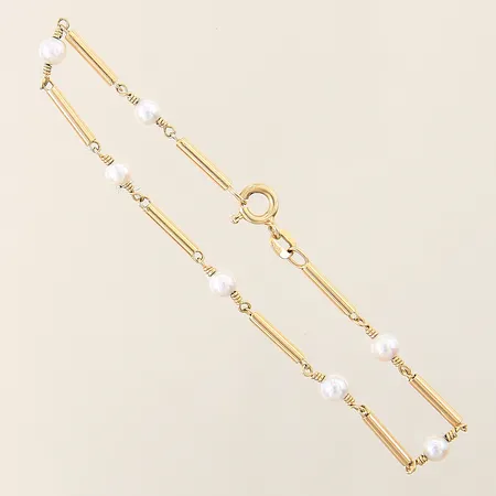 Armband med stavar samt 7 odlade saltvattenpärlor Ø3,9-4,1mm längd 19cm bredd 1,9-4,1mm 18K Vikt: 3,2 g