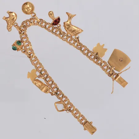 Armband Bismarck med 10 berlocker längd 18,5cm, bredd 6mm, 18K  Vikt: 25,9 g