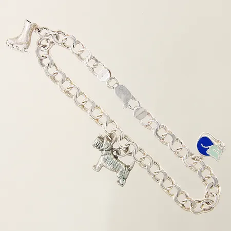 Armband Bismarck med tre integrerade berlocker längd 19cm bredd 6mm silver 925/1000 Vikt: 12,7 g