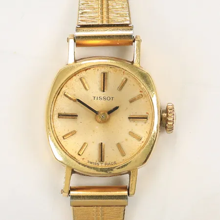 Damur Tissot 16x16mm 18K i boetten, länk ej guld, klockan går ej. 17,3g totalt.