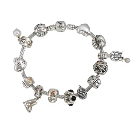 Armband PANDORA med 13 berlocker, silver 925/1000, 12 berlocker Pandora - ALE, en berlock utan stämplar, armband längd 19,5 cm, bredd 3 mm, berlocker med emalj, förgyllda detaljer, pärlor samt vita och svarta stenar, varierande mått, fint skick Vikt: 57,5 g