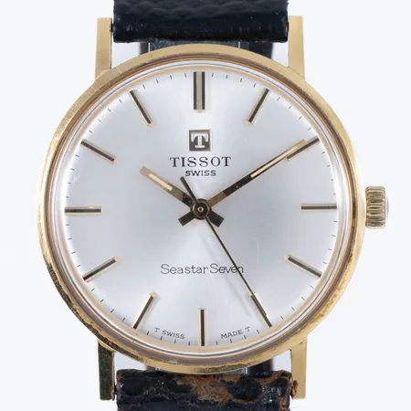 Herrur Tissot Seastar Seven guld 18K manuell 33,5mm plexiglas, svart läderband defekt, svaga repor, inga tillbehör.