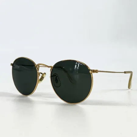 Ett par solglasögon Ray-Ban, Bausch & Lomb, förgyllda bågar, putsduk samt etui.