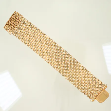 Armband x-länk längd 21cm bredd 38mm, stämplad K&EC, 18K, 115,3g Vikt: 115,3 g