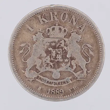 Mynt Oscar II 1 kr år 1889 Ø25mm, 800/1000 silver Vikt: 7,3 g